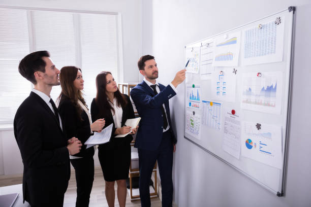 Professionals discussing company expectations and qualifications for an insurance agent