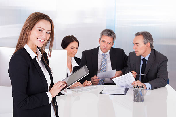 Insurance agent presenting policy to clients.