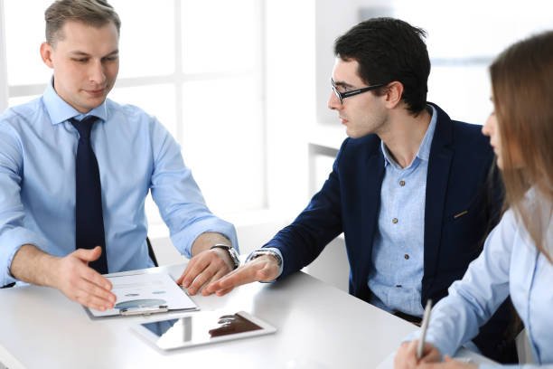  Independent insurance agent meeting with client.