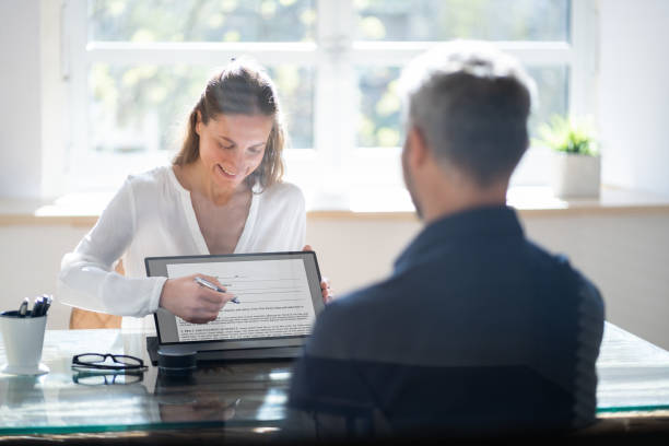 Skilled insurance agents working together in a client meeting.