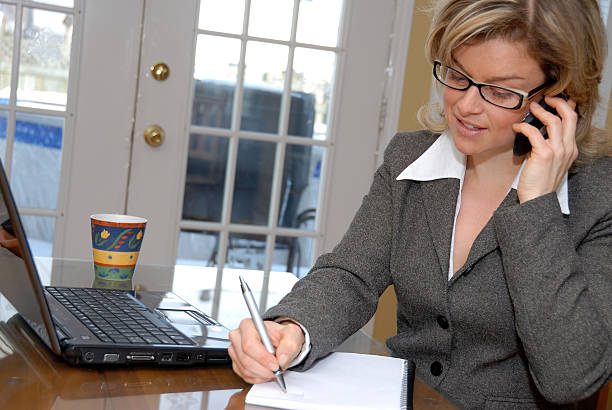 A confident insurance agent working diligently at their desk, focused on providing exceptional service to clients.
