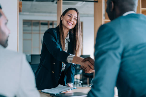  "A friendly insurance agent listening attentively to a client, building a personalized connection for long-term success."