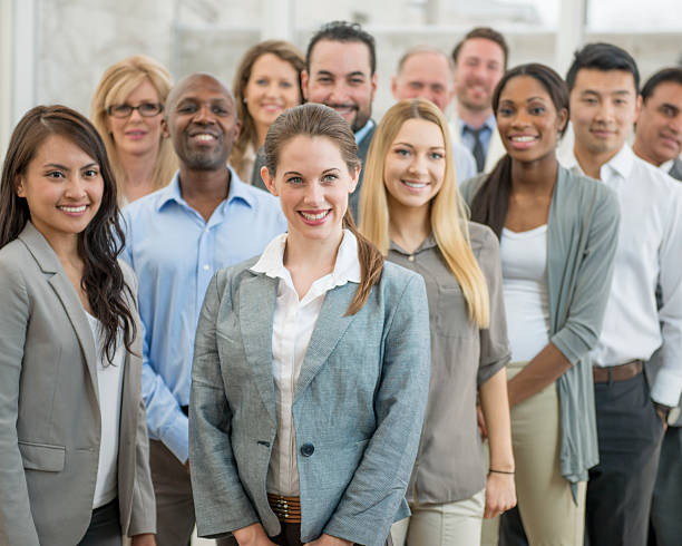 "A diverse group of confident insurance agents in a professional setting, exhibiting expertise and professionalism."
