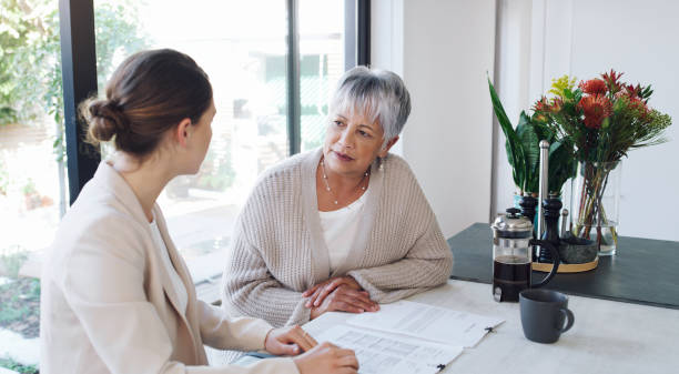 Two individuals discussing insurance policies.