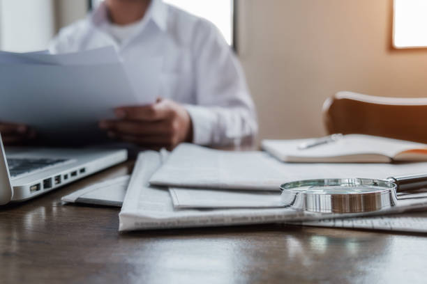 Person working on insurance documents at home