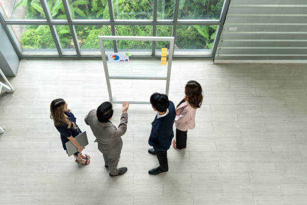 Diverse professionals standing together at Elite Life Agency.