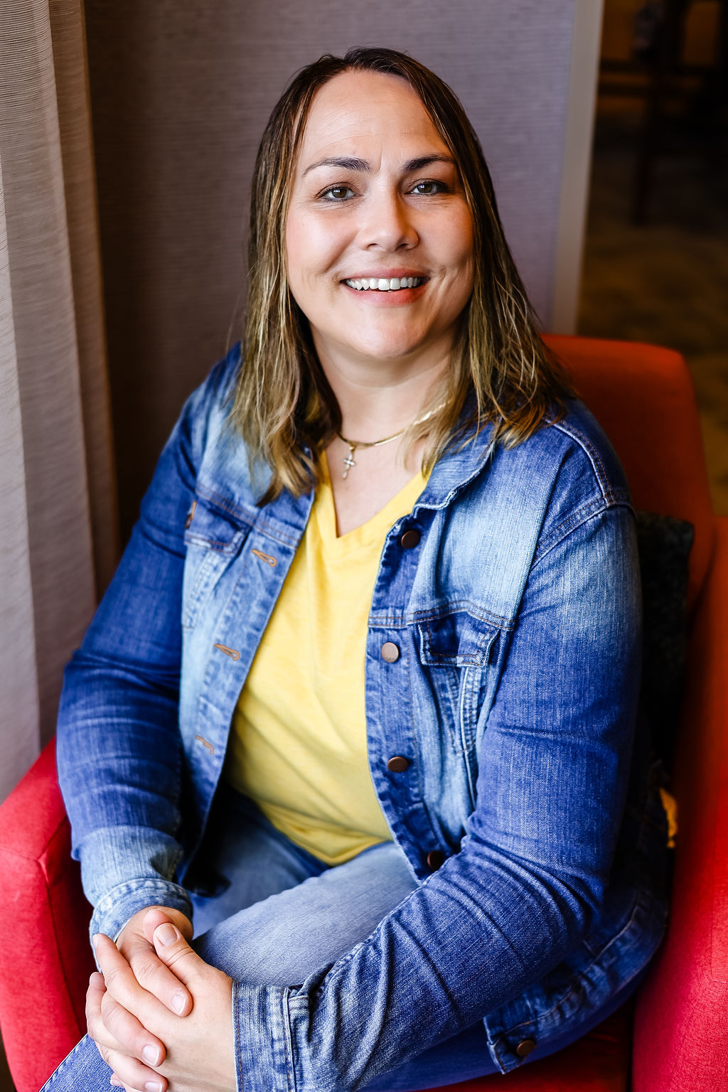 A casual photo of Lori Lafferty sitting and smiling very approachable wanting to discuss photo storage, icloud storage, digitization, and even Facebook storage