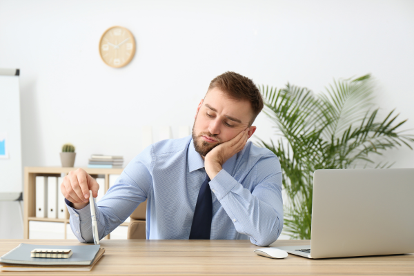 man thinking at a desk