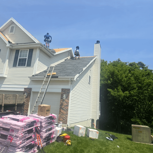 JBS Roofers professional crew at work on residential roofing project in Columbia MO showing expert installation process
