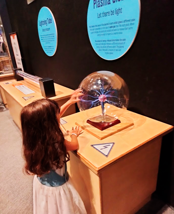 A girl touching a plasma ball A girl touching a plasma ball