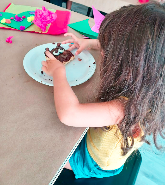 A girl decorating a brownie at Once Upon a Creation in Clermont, Florida A girl decorating a brownie at Once Upon a Creation in Clermont, Florida