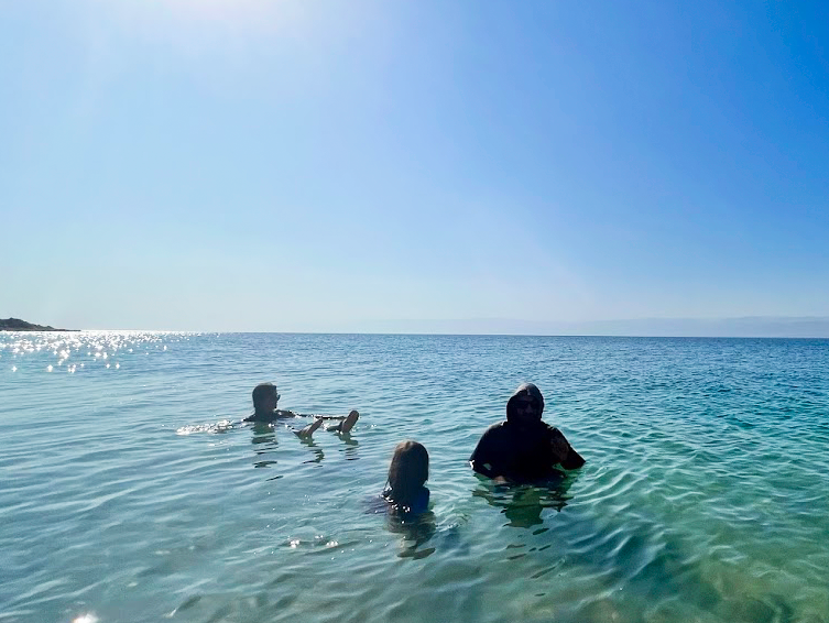 Family of three in the Dead Sea Family of three in the Dead Sea