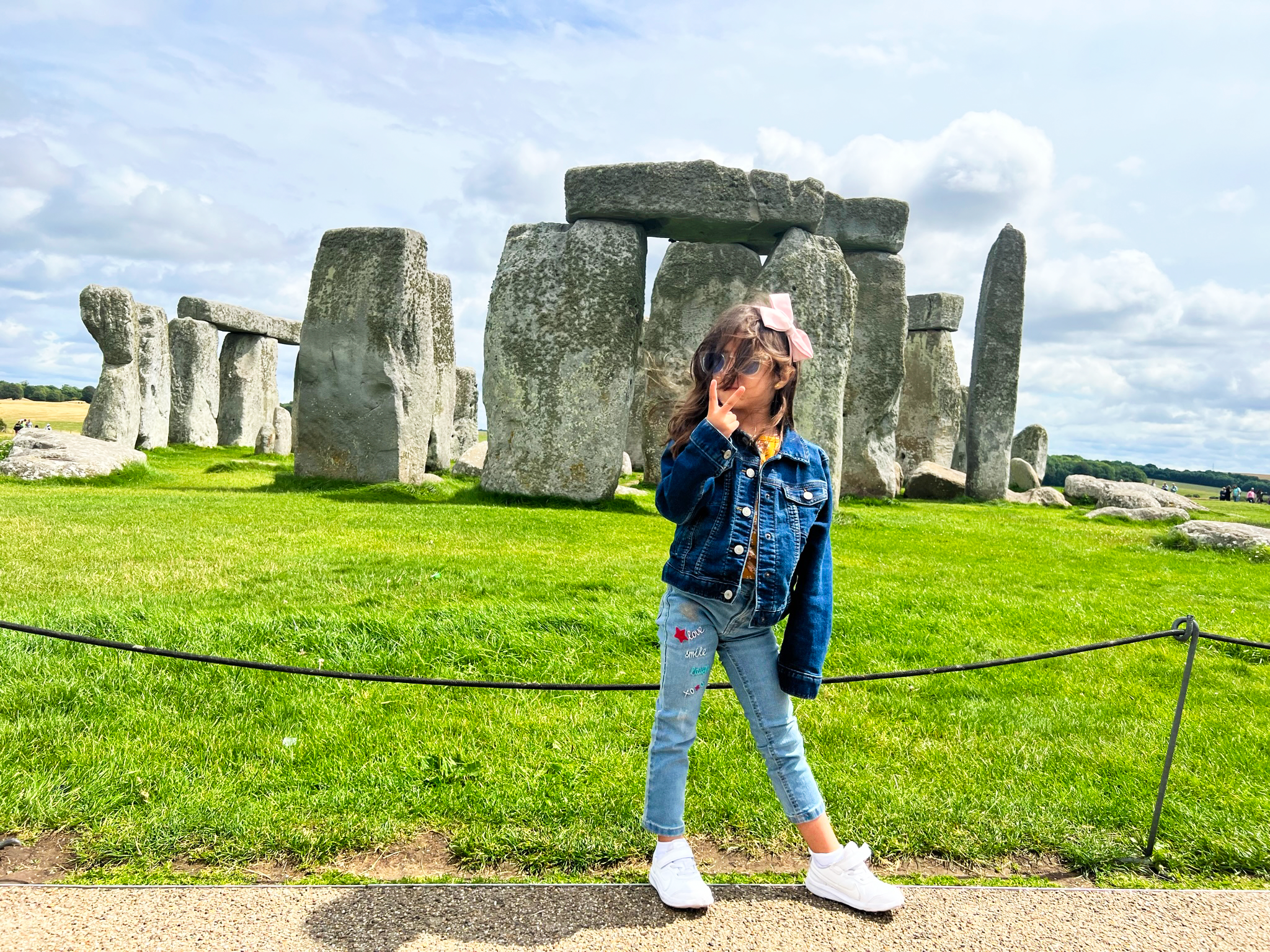 Girl in front of the Stonehenge Historical landmark Girl in front of the Stonehenge Historical landmark