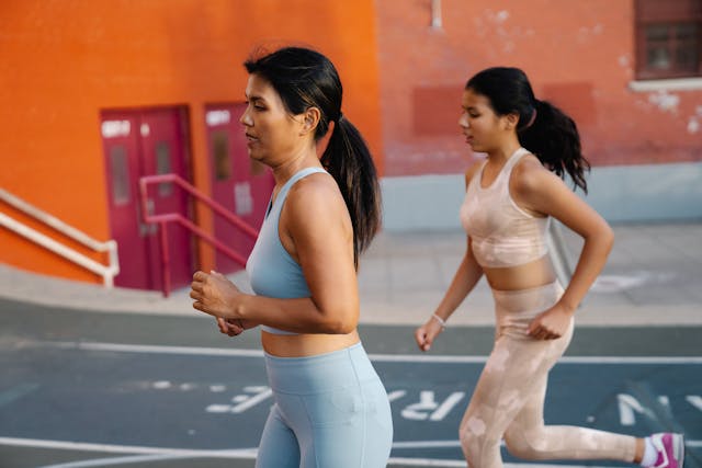 Woman and girl running Woman and girl running