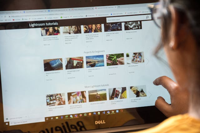 Woman searching tutorials on her laptop Woman searching tutorials on her laptop