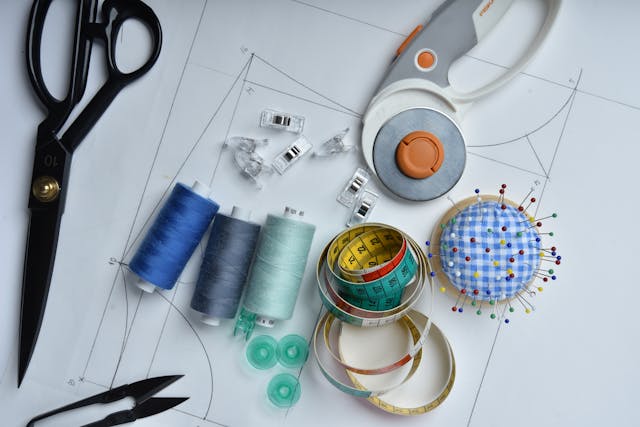 Sewing tools and accessories on pattern paper Sewing tools and accessories on pattern paper