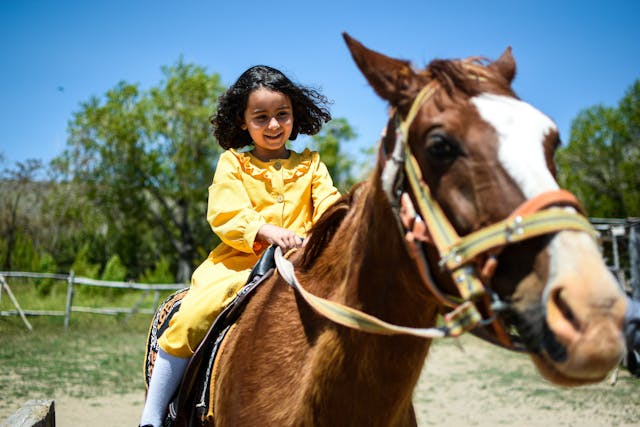 A girl riding a horse