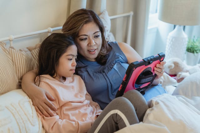 Mom and daughter watching a movie