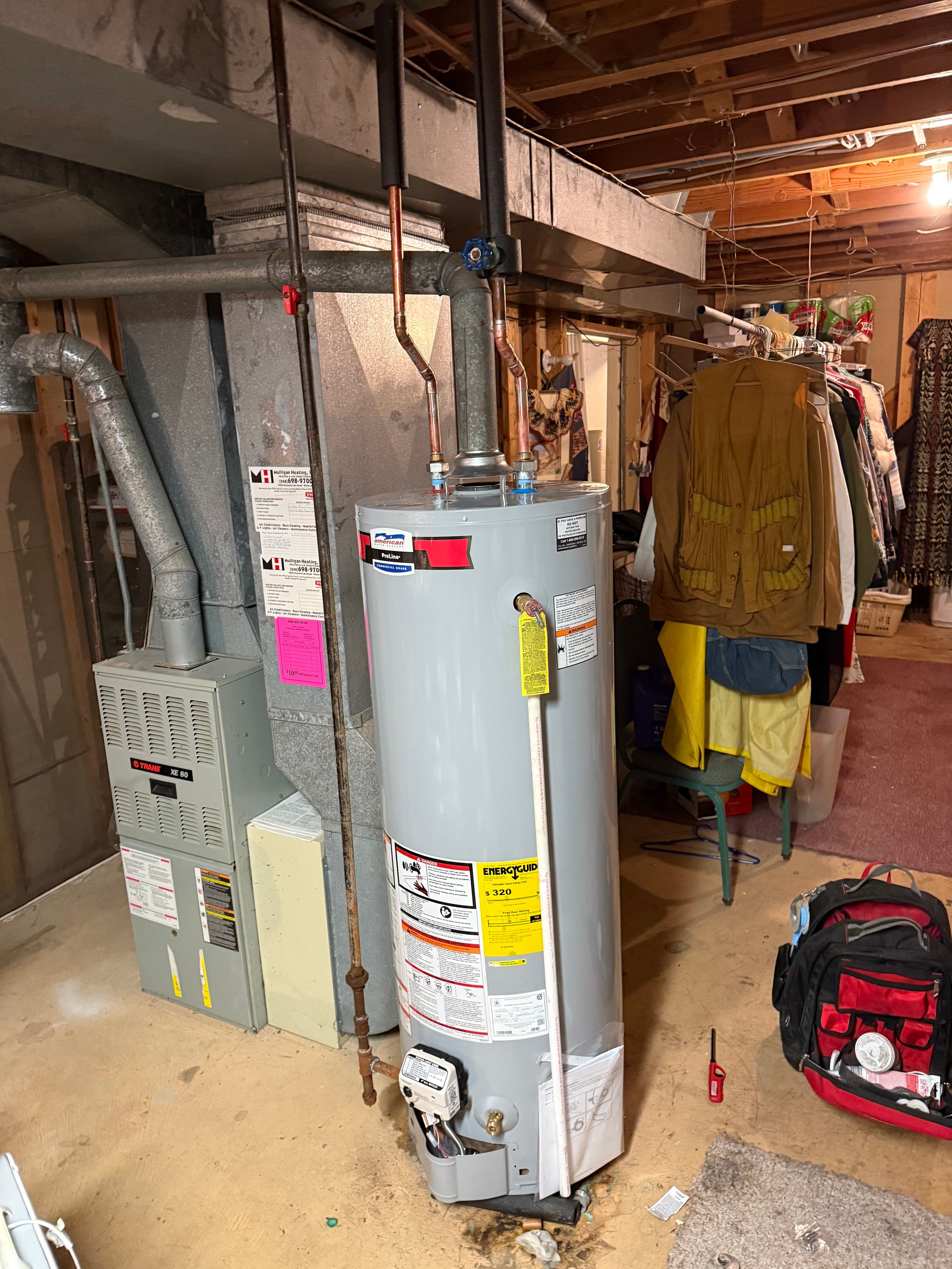 Veteran-owned plumber installing water heater