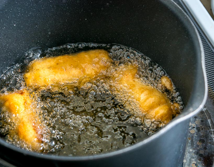 frying the battered fish