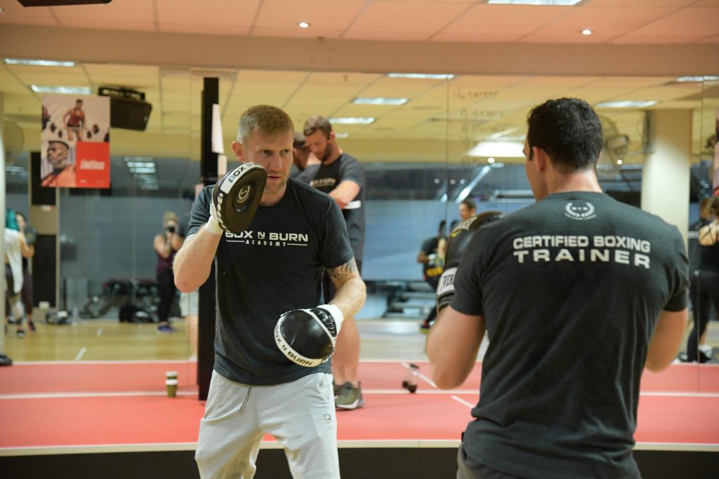 Holding-Boxing-Mitts Holding-Boxing-Mitts