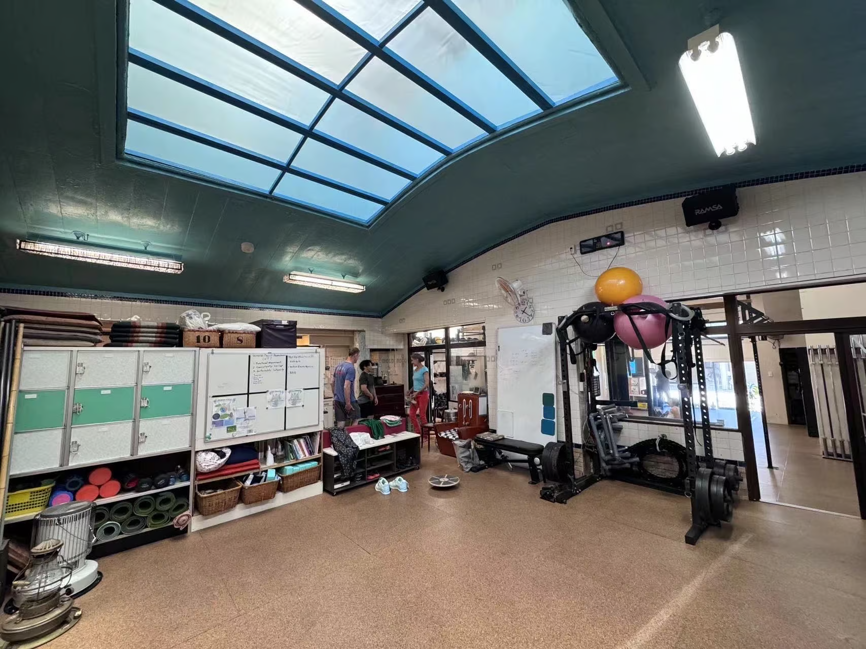 Spacious gym with a skylight ceiling, weightlifting equipment, storage lockers, and training gear at Venus Weightlifting. Spacious gym with a skylight ceiling, weightlifting equipment, storage lockers, and training gear at Venus Weightlifting.