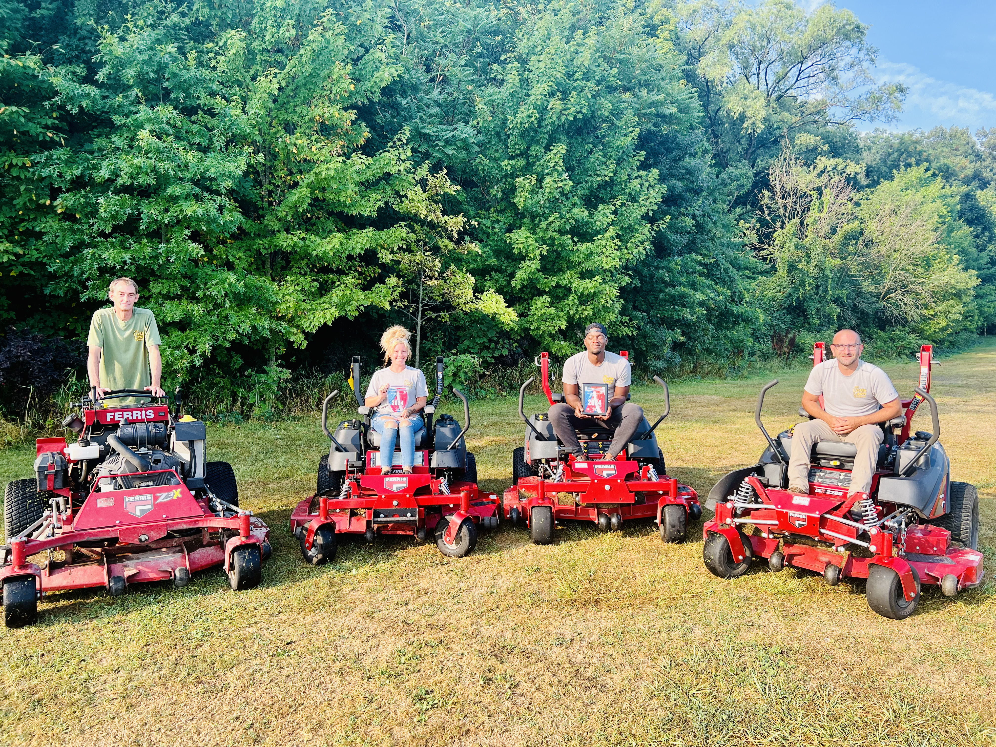 The Little Lawn Co. team providing residential lawn mowing service in Altoona