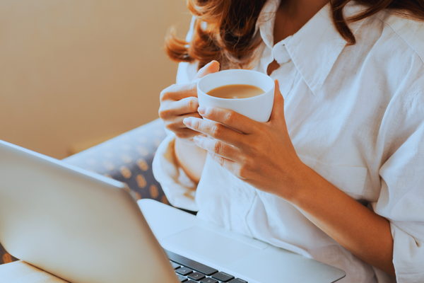 woman with computer and coffee woman with computer and coffee