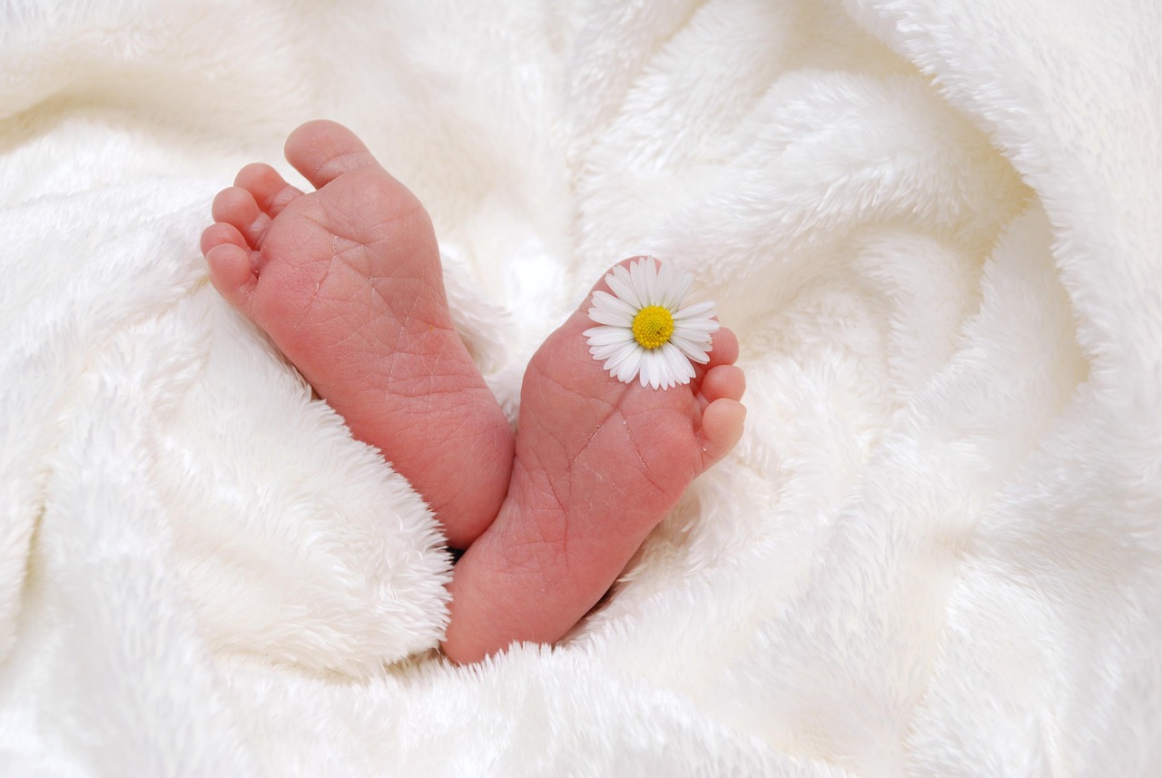 feet sticking out of blanket