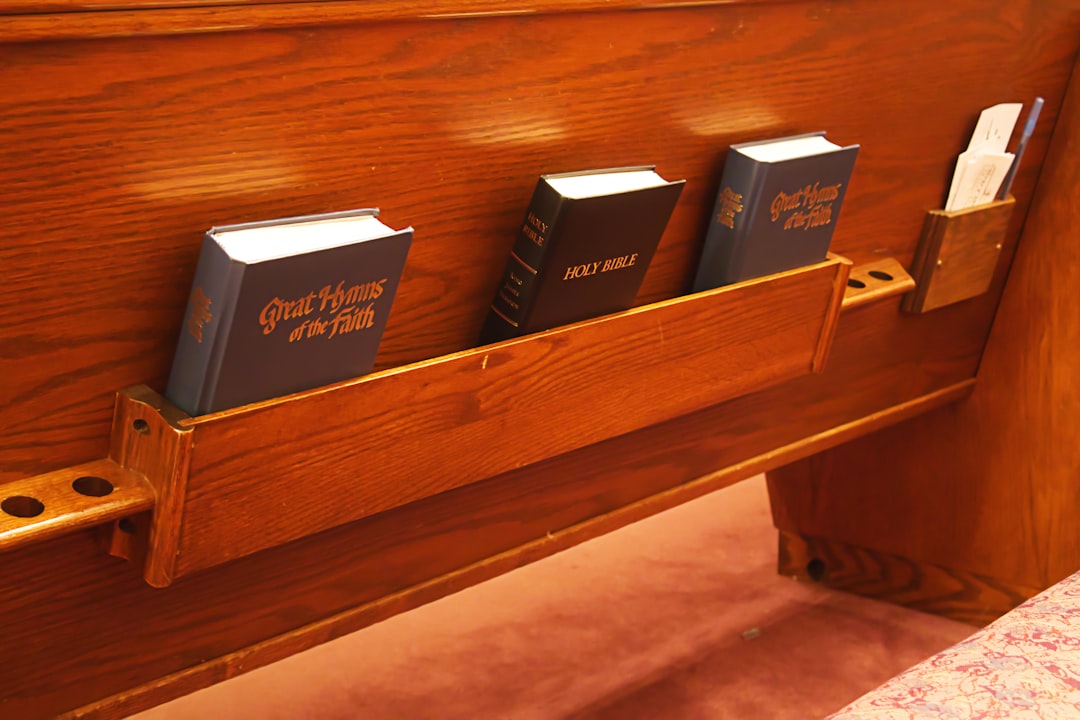 church pew with hymnals church pew with hymnals