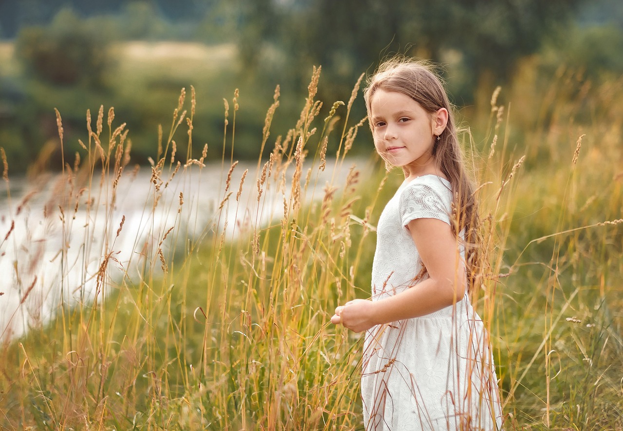 young girl in field, representing hope for grieving children