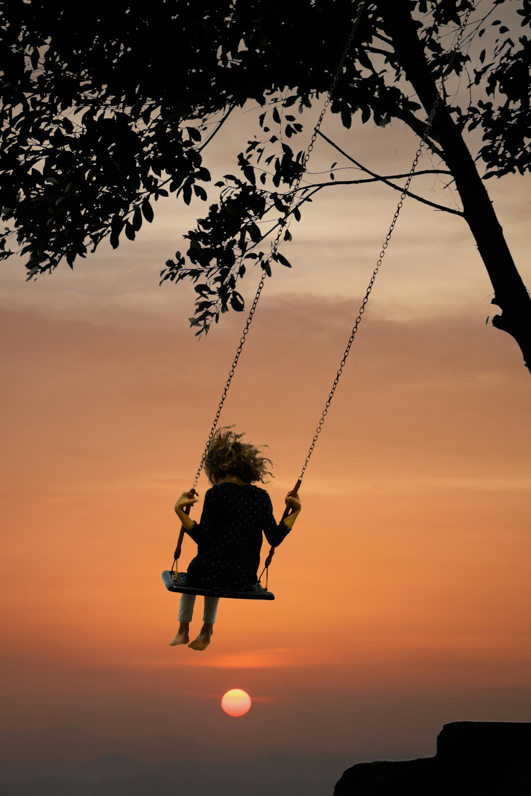 child swinging