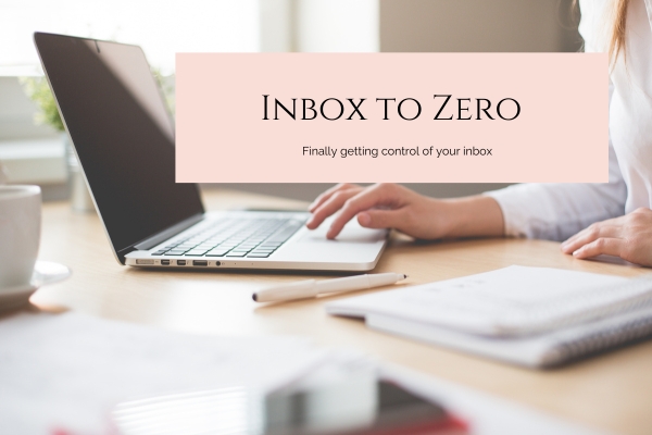 Inbox to zero working at your computer and looking at the emails