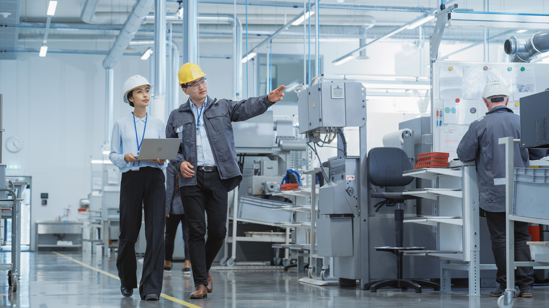 Factory workers collaborating