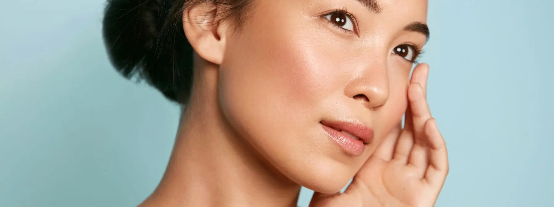 Portrait of a woman with clear, radiant skin gently touching her face, showcasing the smooth, glowing results often achieved through professional chemical peel treatments in Greenville, SC. Portrait of a woman with clear, radiant skin gently touching her face, showcasing the smooth, glowing results often achieved through professional chemical peel treatments in Greenville, SC.