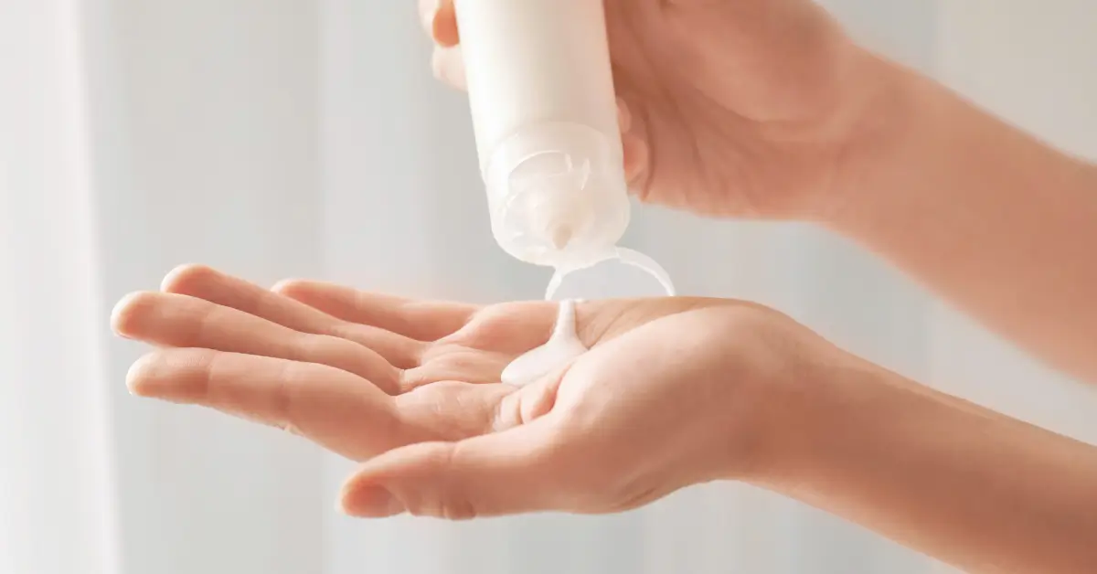 Close-up of hands dispensing a gentle lotion from a bottle
