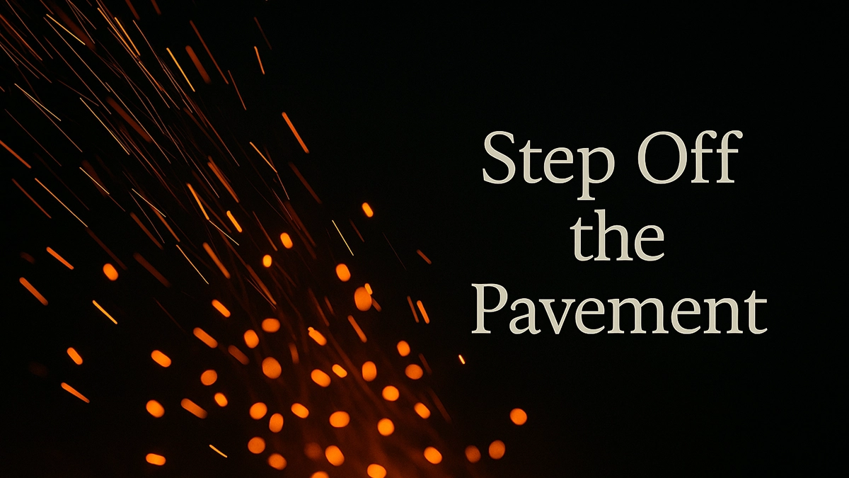 Close-up of fiery orange sparks streaking across a dark backdrop - "Step Off the Pavement" Close-up of fiery orange sparks streaking across a dark backdrop - "Step Off the Pavement"