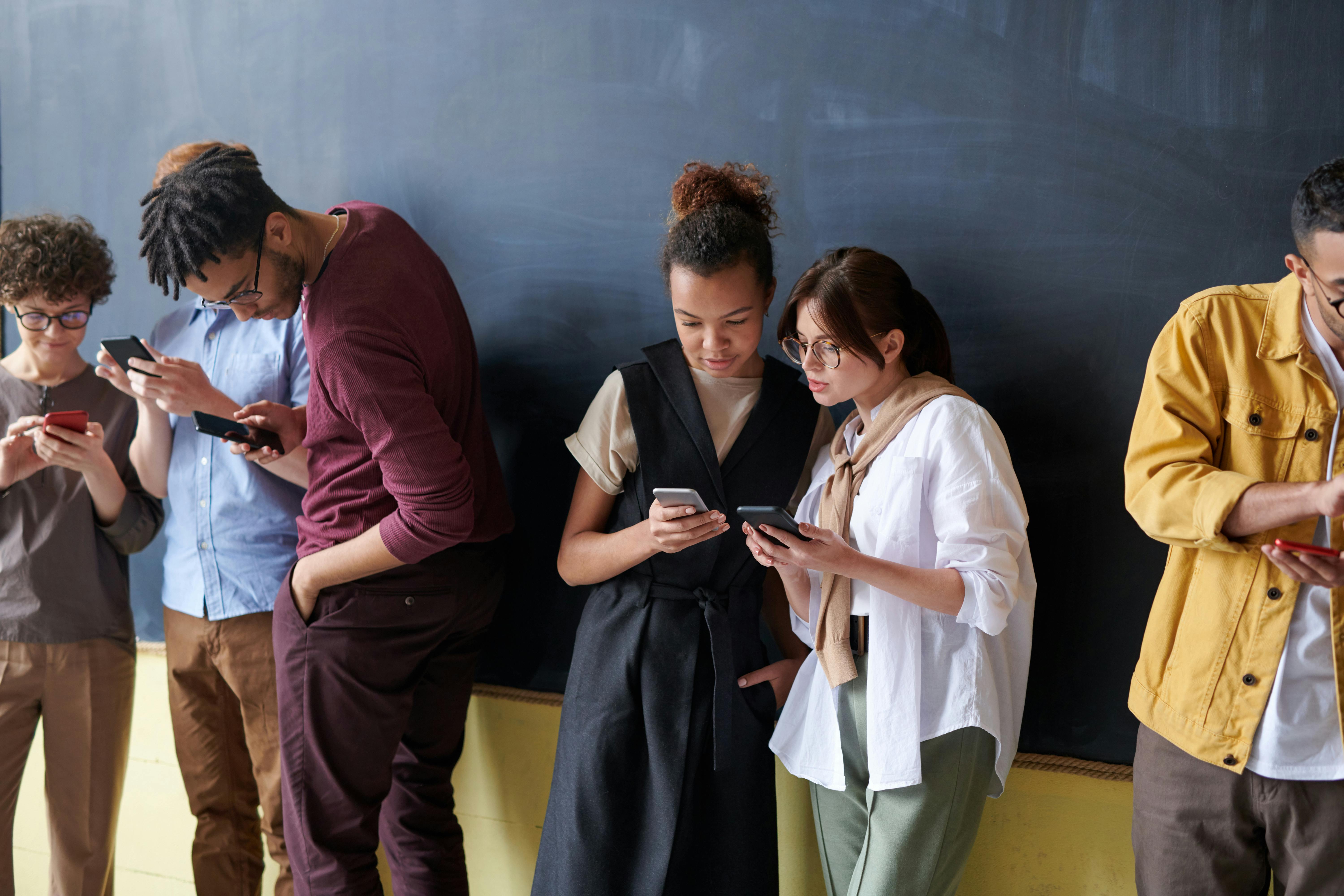 People looking at their phones