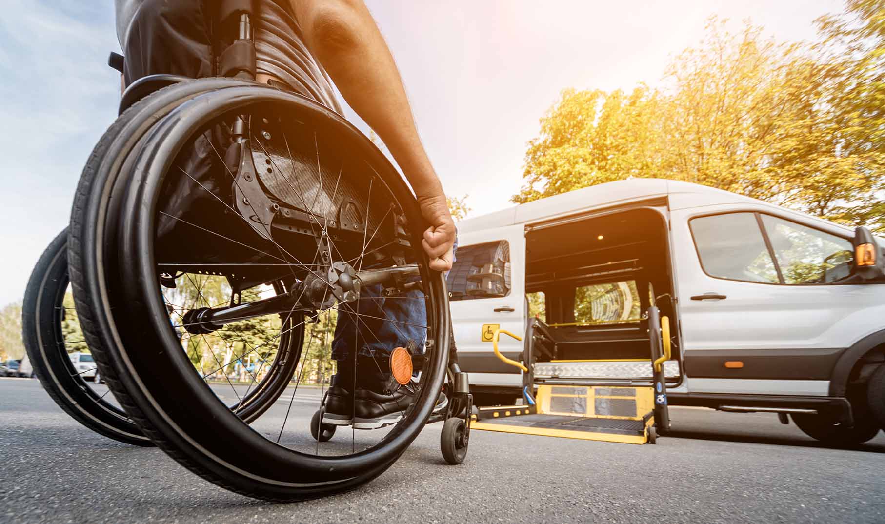 Man in wheelchair getting non emergency medical transportation