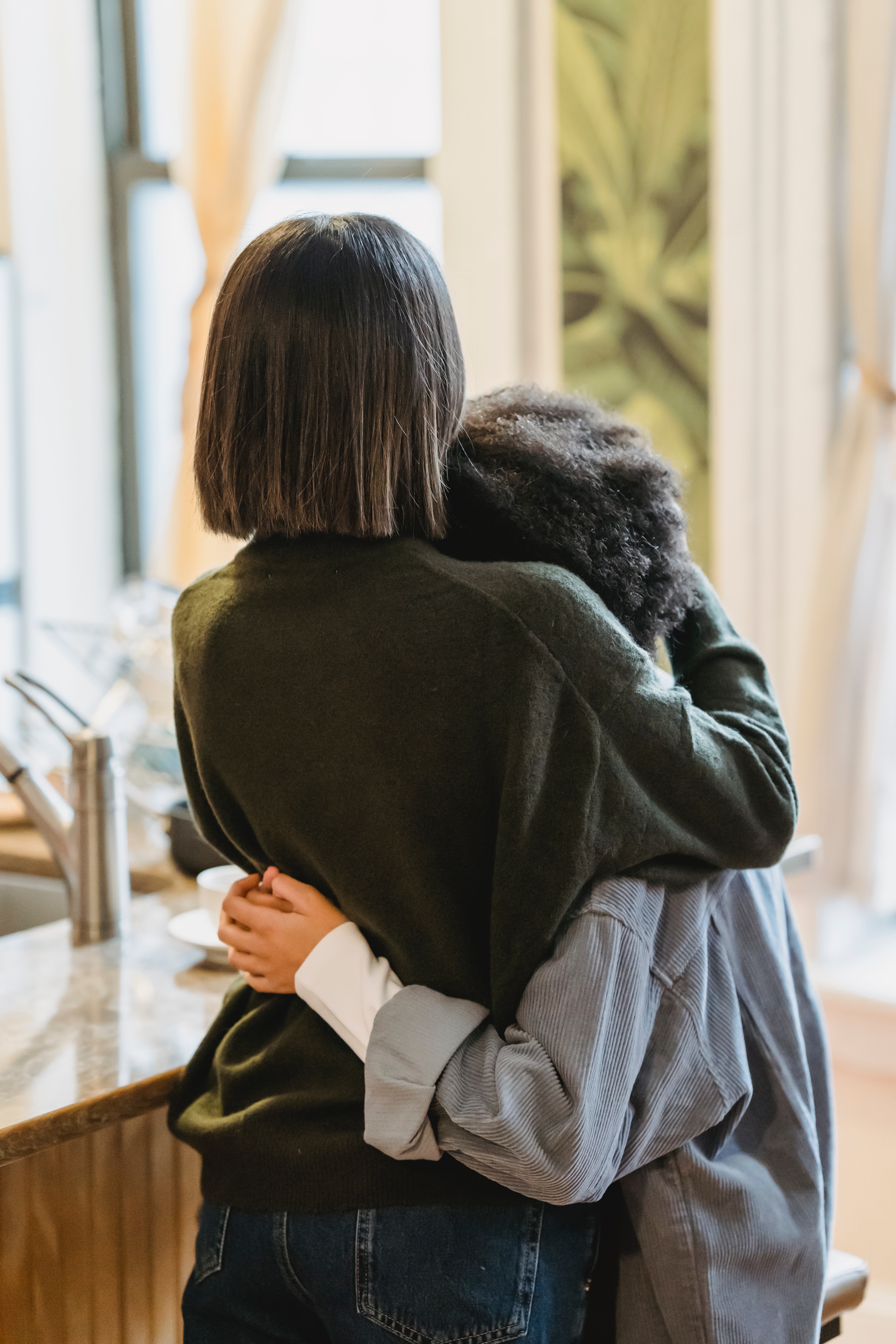 woman hugging her child