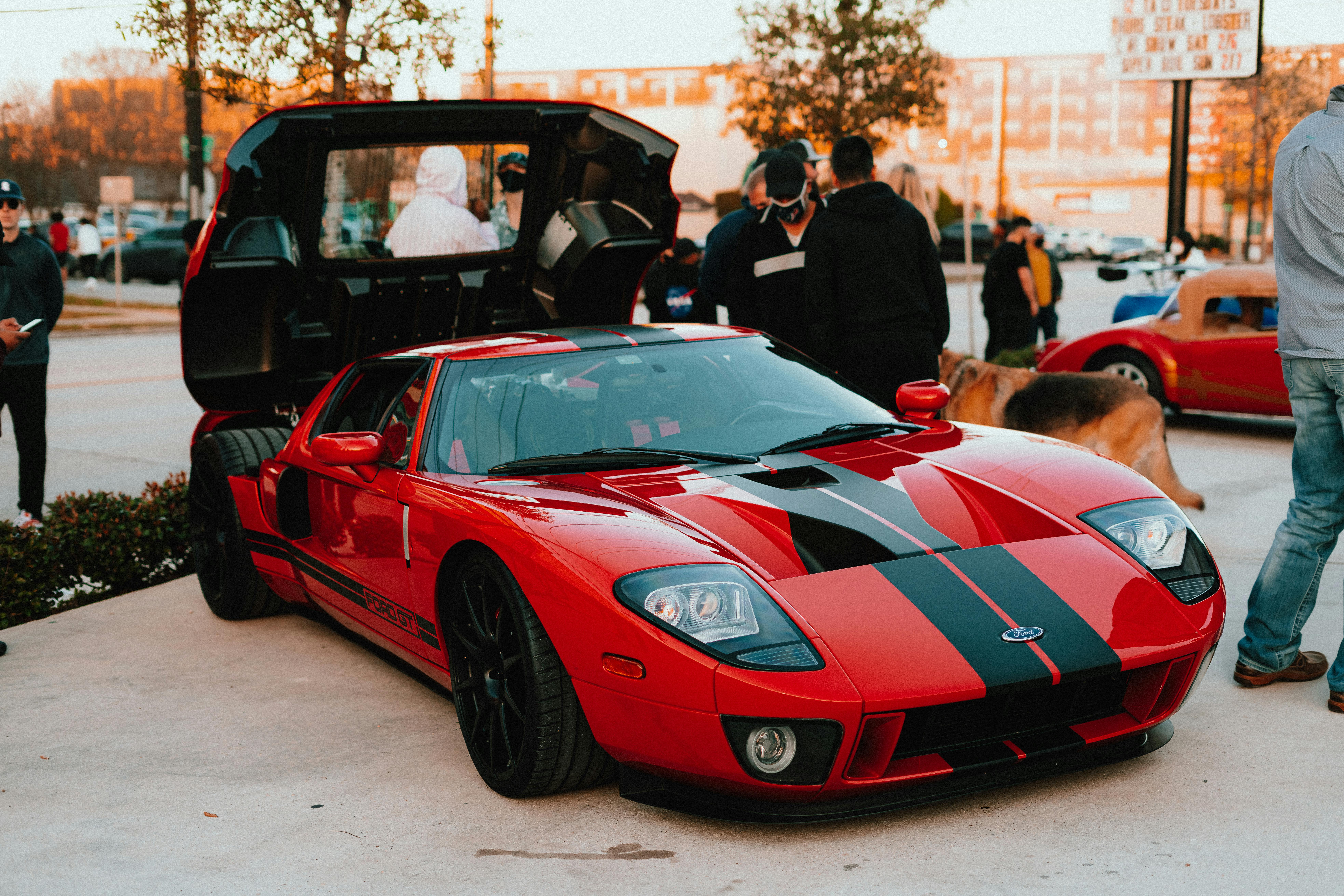 Glossy red Nissan 300ZX turbo with ceramic-protected paint at a Houston car meet