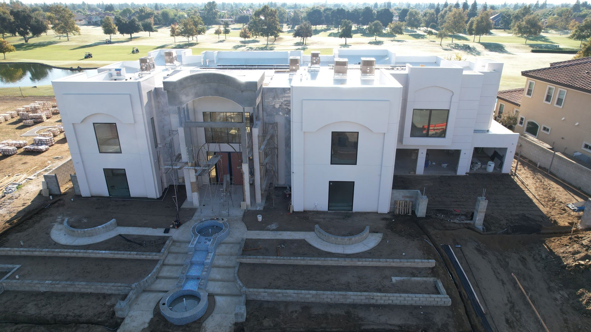 Diaz Plastering crew finishing exterior stucco on a Bakersfield, CA home – smooth texture finish