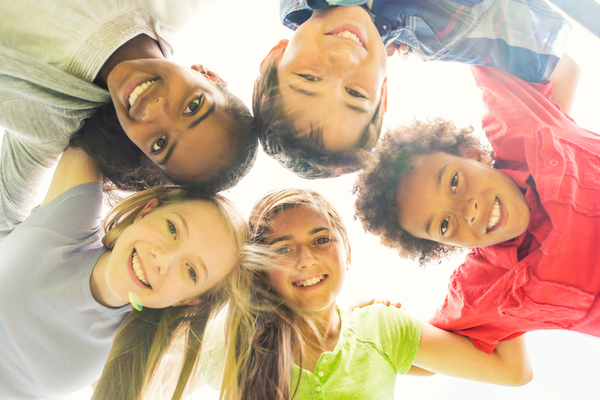 smiling tweens in a circle smiling tweens in a circle