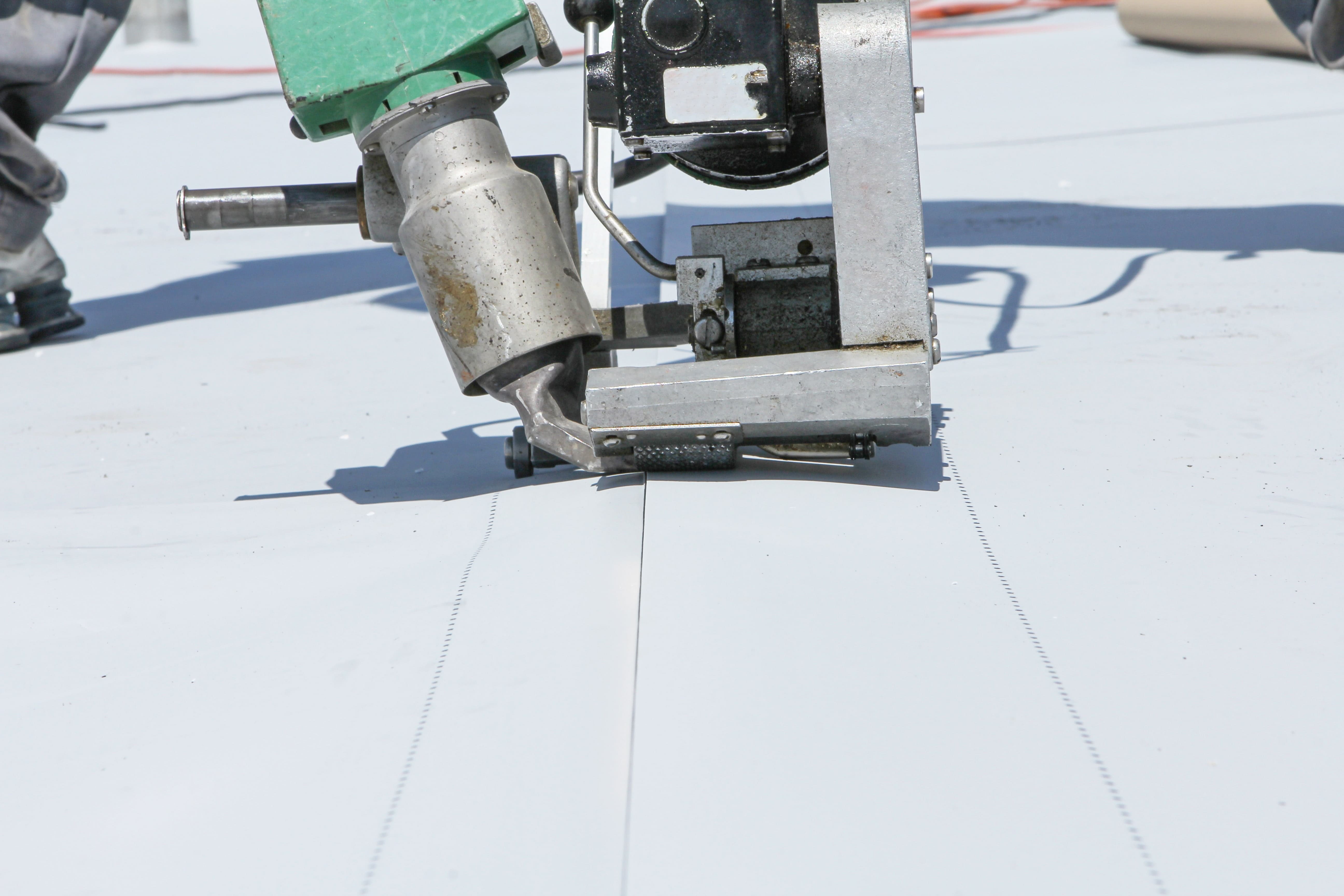Roofing experts install flat roof