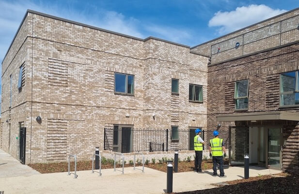 VME inspecting outside of the Bridgewell Supported Living Building