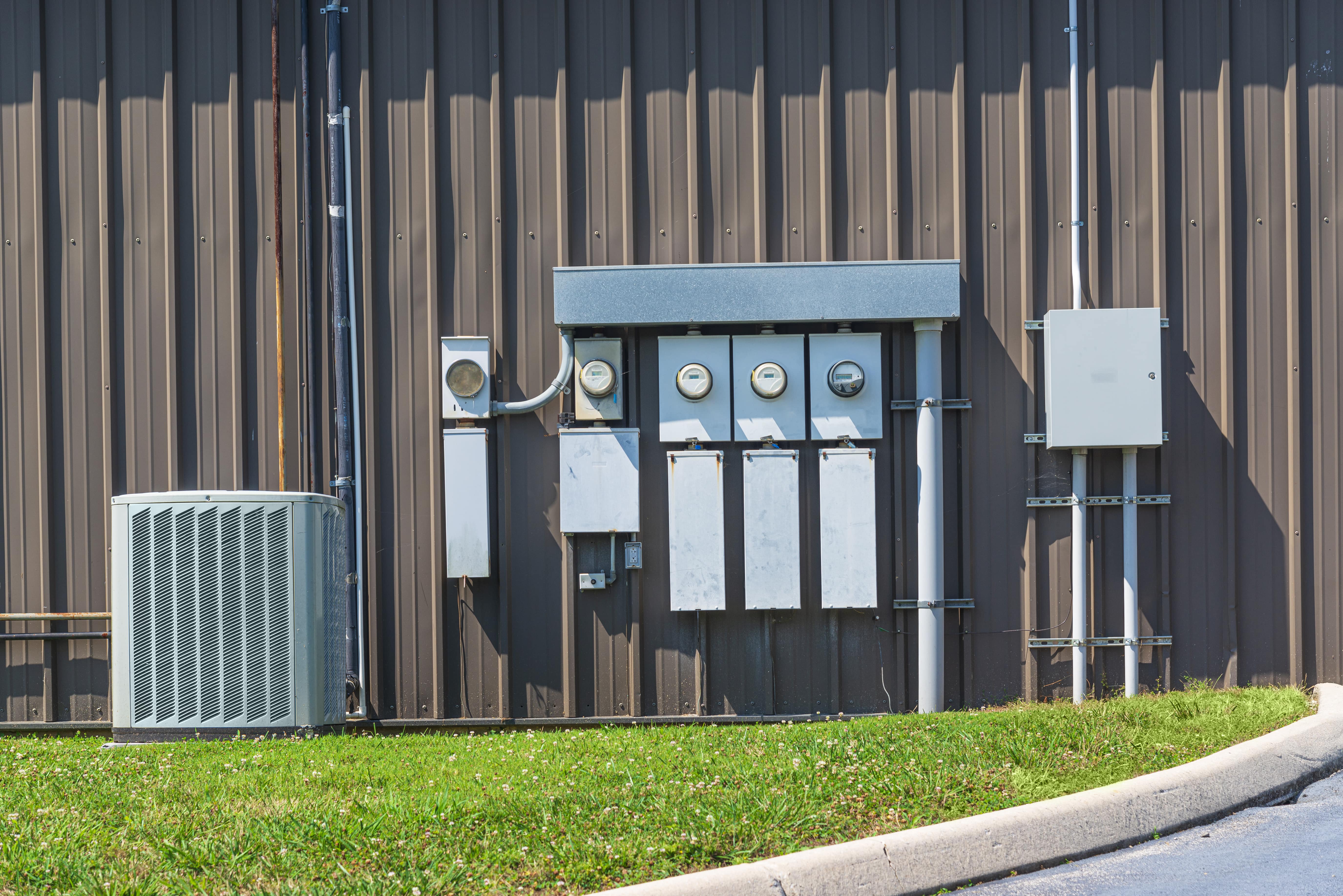 HVAC air conditioner and meters outside of office building