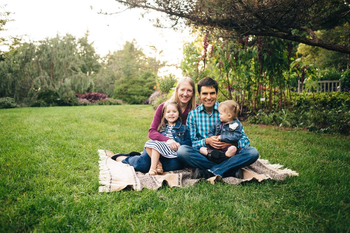 Family portrait during sunset session. Family of four with two daughters.