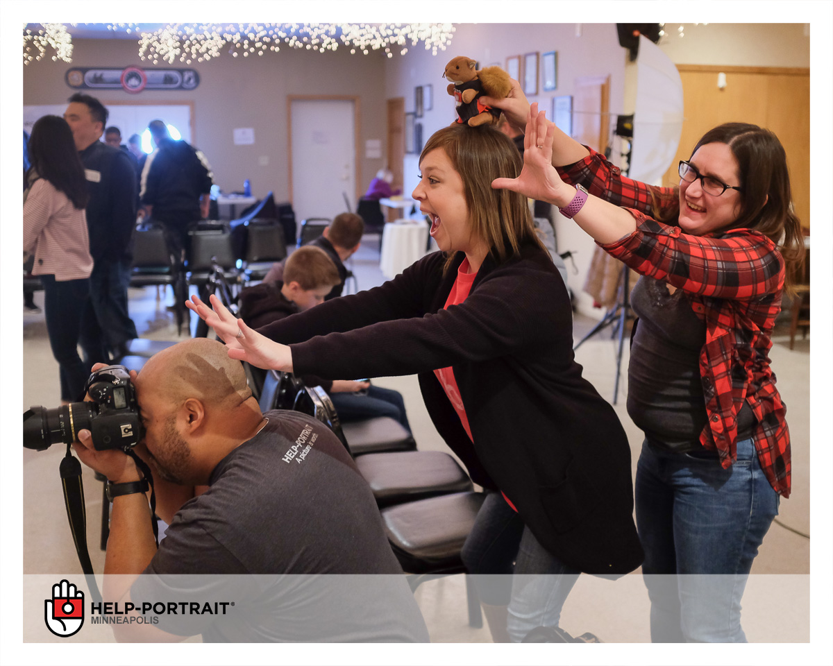 Wounded Warrior Project, Help-Portrait event Twin Cities. Volunteers make faces behind a photographer to help children smile.