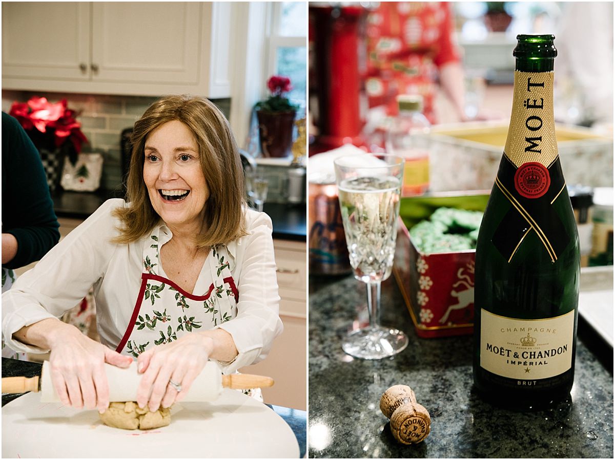 Mother smiles as she rolls dough and drinks champagne. 