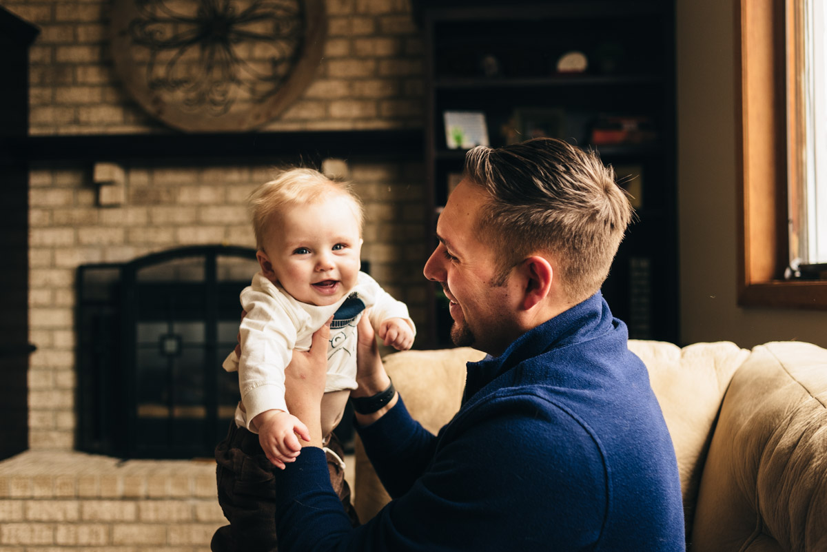 Father with 9 month old son in woodbury in-home session.